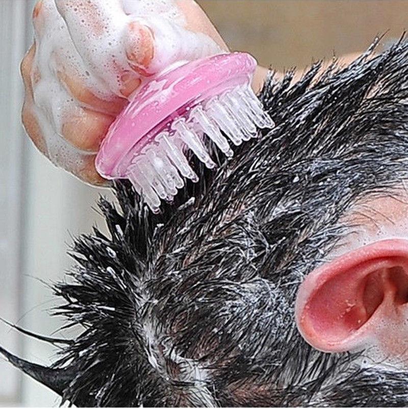 Silicone brush working shampoo into scalp foam
