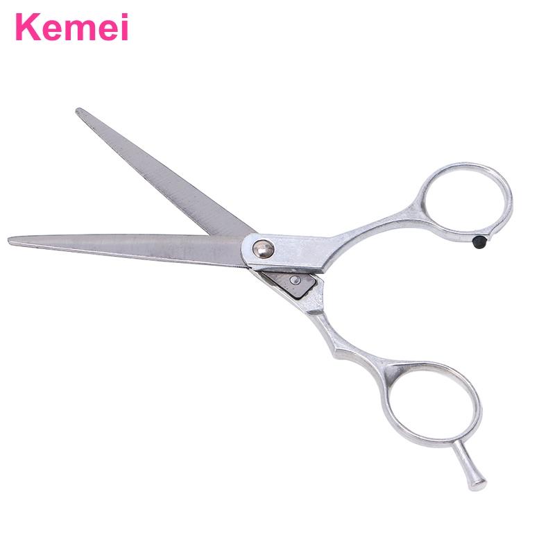 Sharp cutting blade edge on an open silver salon shear