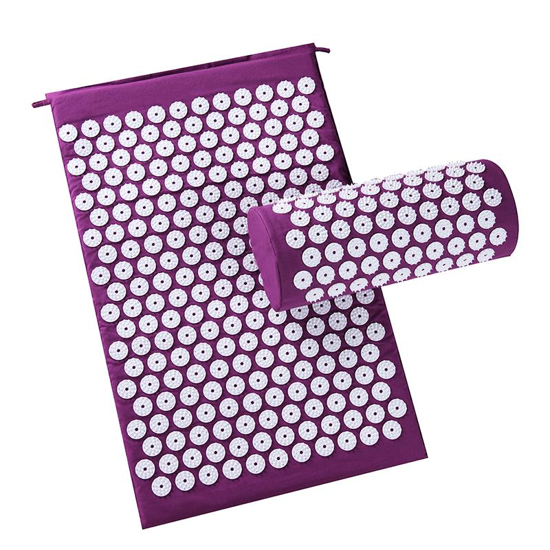 Purple acupressure mat with pillow rolled out, showing thousands of white acupressure points