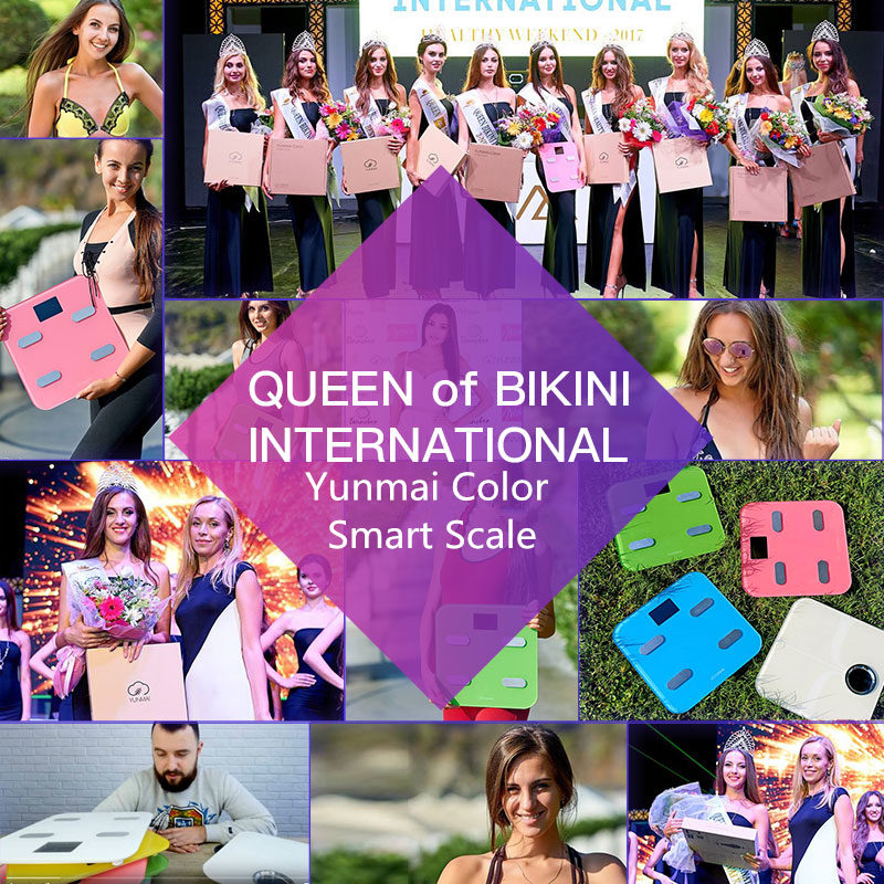 International beauty competition winners with 'Queen of Bikini International' branding holding pink and colored Yunmai scales