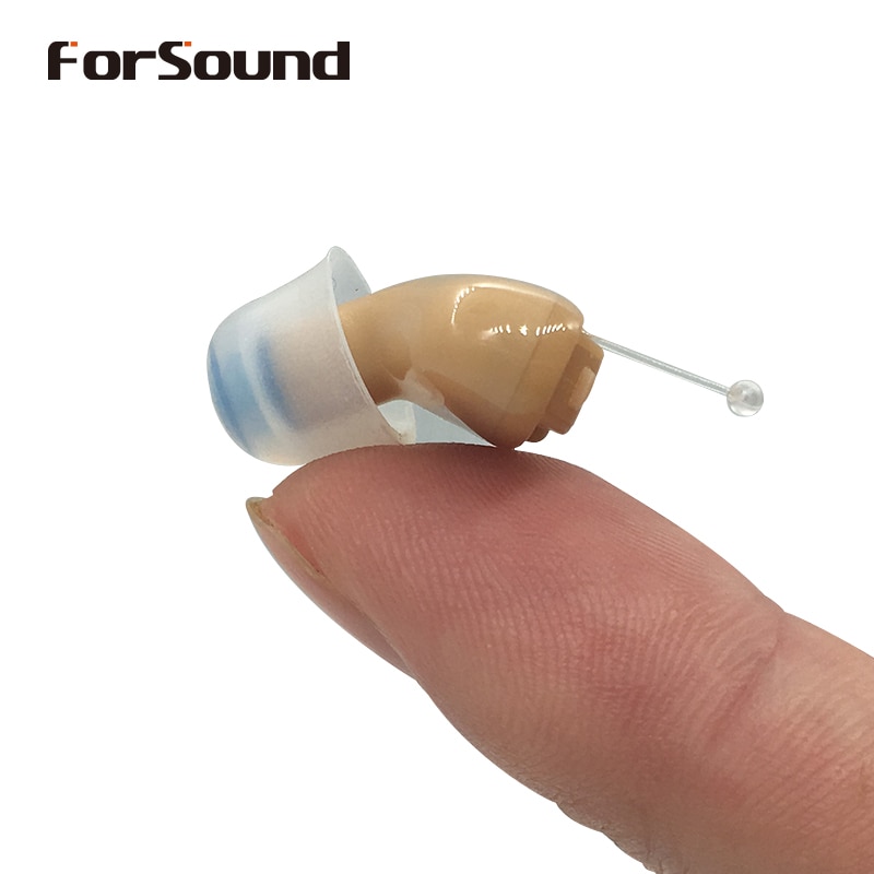 Mini CIC hearing aid shown in palm of hand with frosted clear eartip dome and retrieval string, demonstrating discreet size
