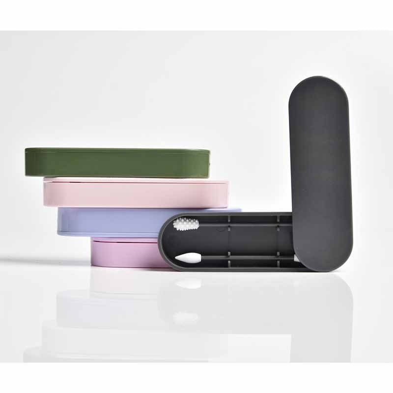 Four pastel storage cases stacked in sage, pink, lavender and periwinkle, demonstrating organized, zero-waste living