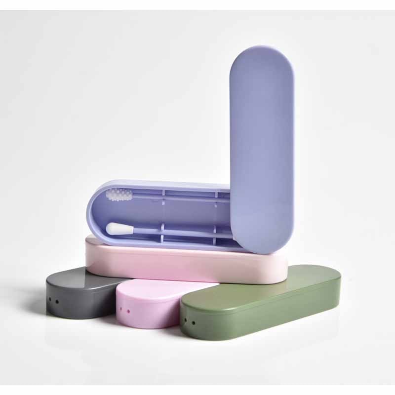 Single periwinkle blue swab with its storage case open, revealing the reusable design