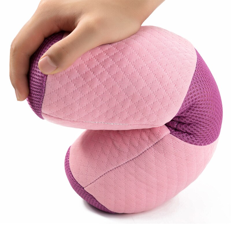 Hand pressing into bolster demonstrating cushioned support and comfort