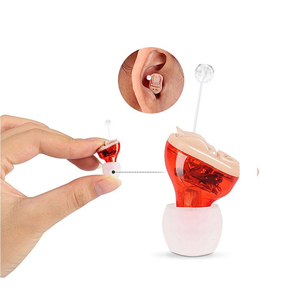 Elderly hands gently holding the tiny red gel-chamber hearing device, symbolizing hope against isolation