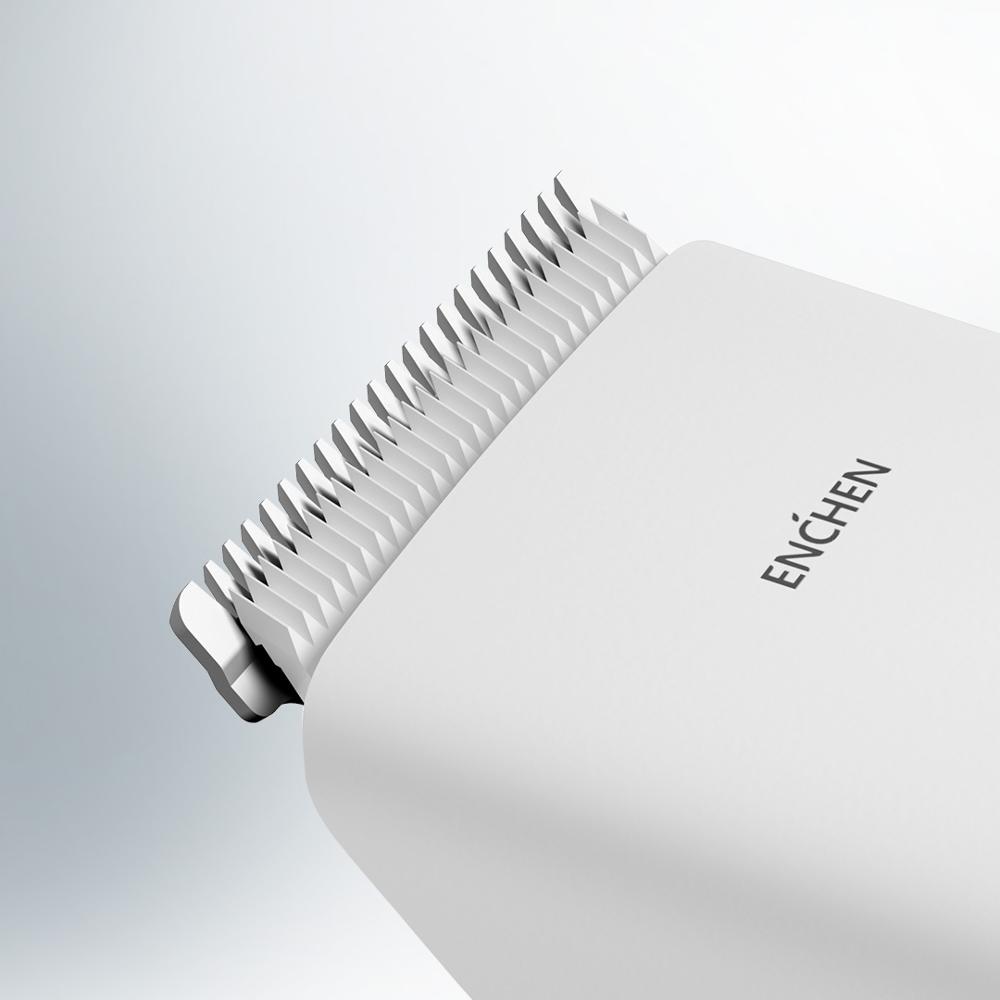 Fine metallic teeth on white comb-style clipper head