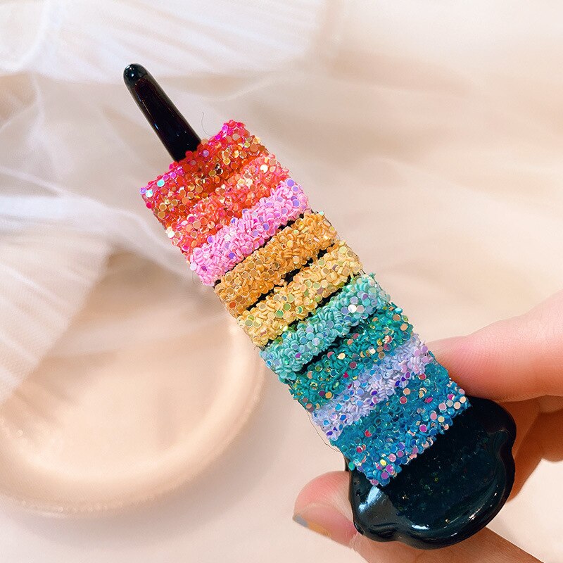 Vivid multicolor embellishments on glossy black clip