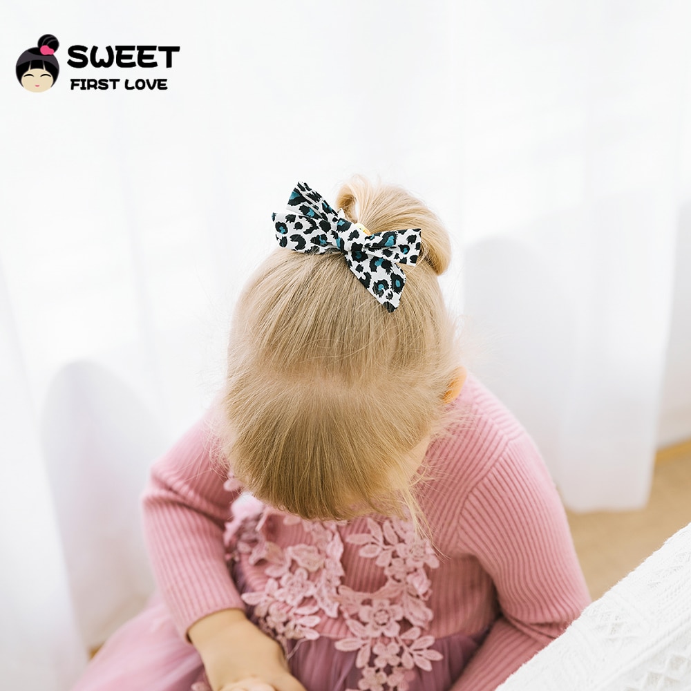 Girl wearing leopard bow in tied hairstyle