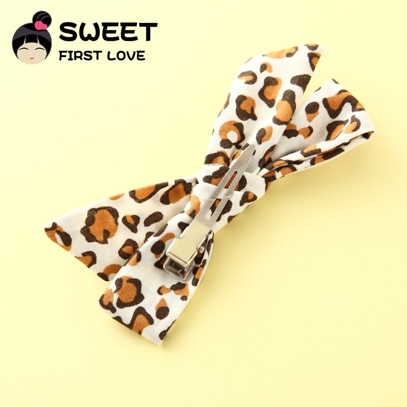 Metal snap clip attached to leopard bow