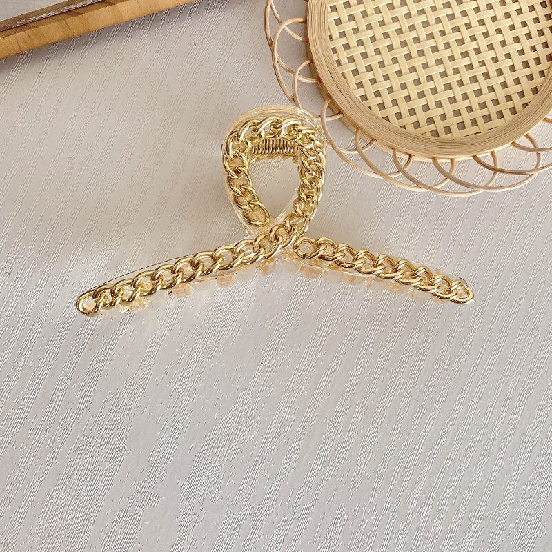 Full-size amber claw clip with gold chain ornament