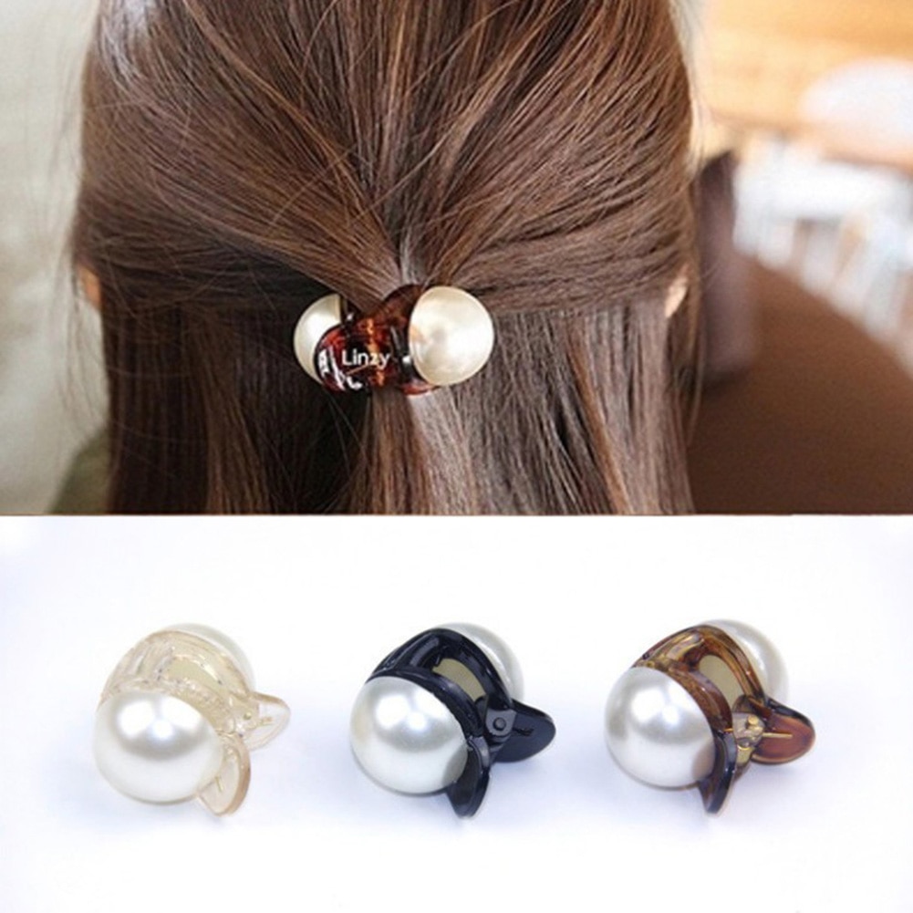 Mini pearl claw clip holding a half-up hairstyle
