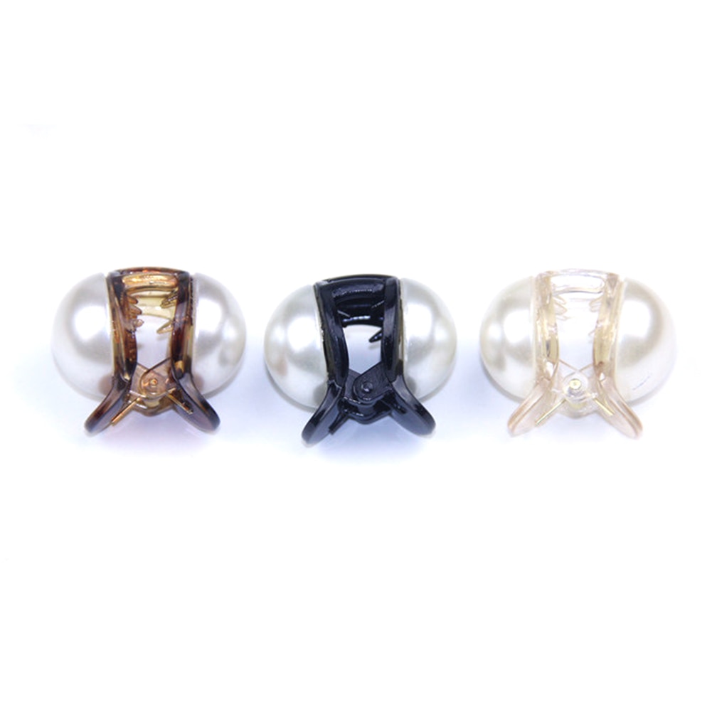 Black amber and champagne pearl clips arranged together
