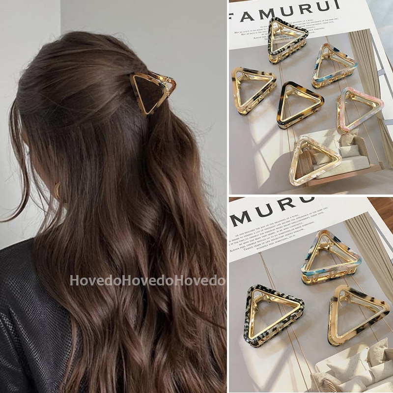 Tortoiseshell clip gathering wavy hair neatly