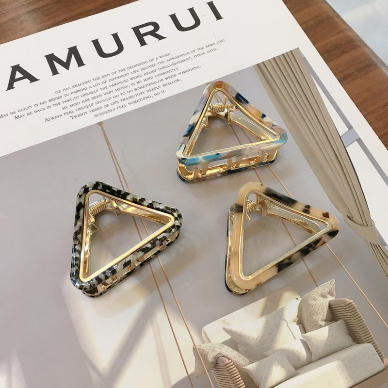 Open triangular hair clips with gold-toned edging