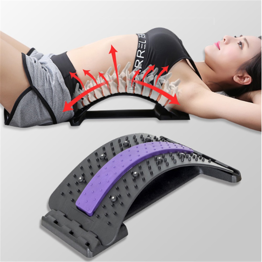 Woman lying on mat using back stretcher with red directional arrows showing muscle engagement and stretch activation across lumbar and lower back regions