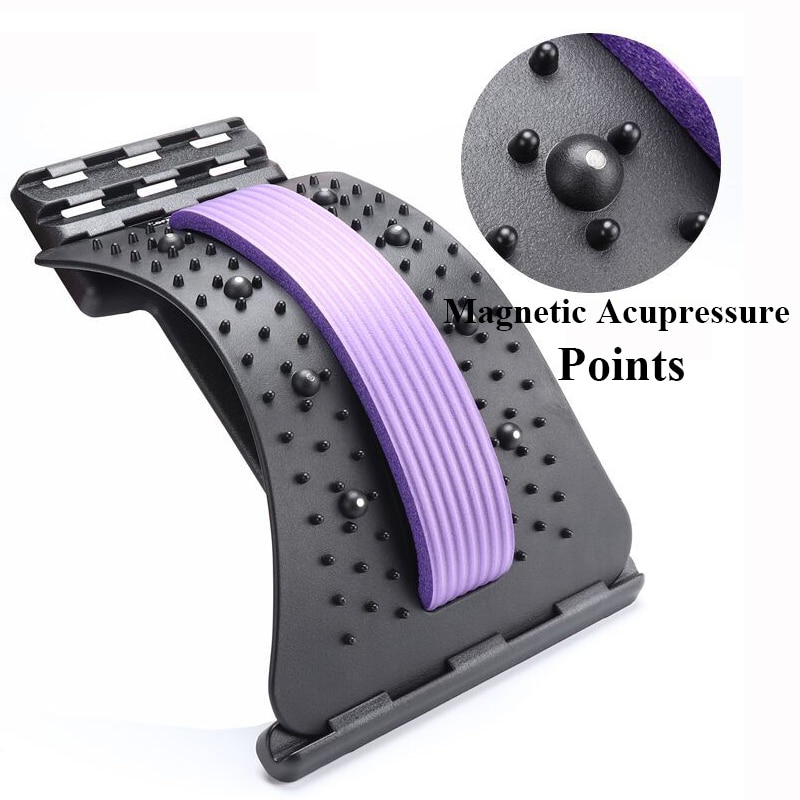 Back stretcher placed on wooden floor showing full length with purple stripe and multiple texture zones, highlighting its portable design