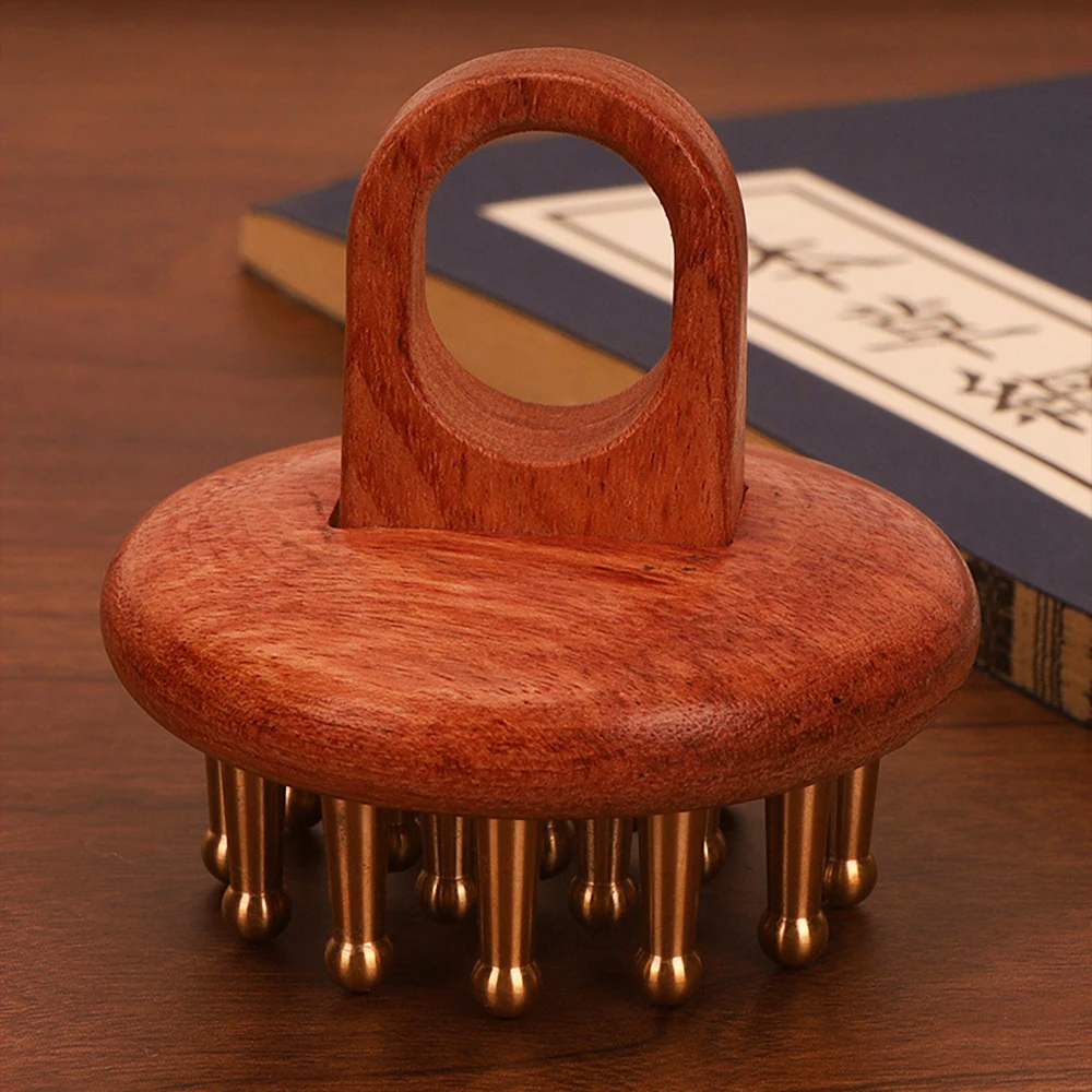 Antimicrobial copper massage comb placed near styled desk accessories, evoking everyday stress and the search for relief