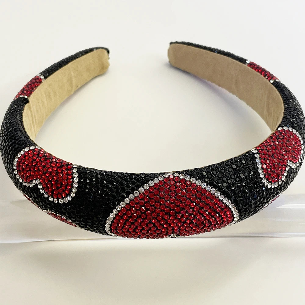 Reflective rhinestones across black heart headband