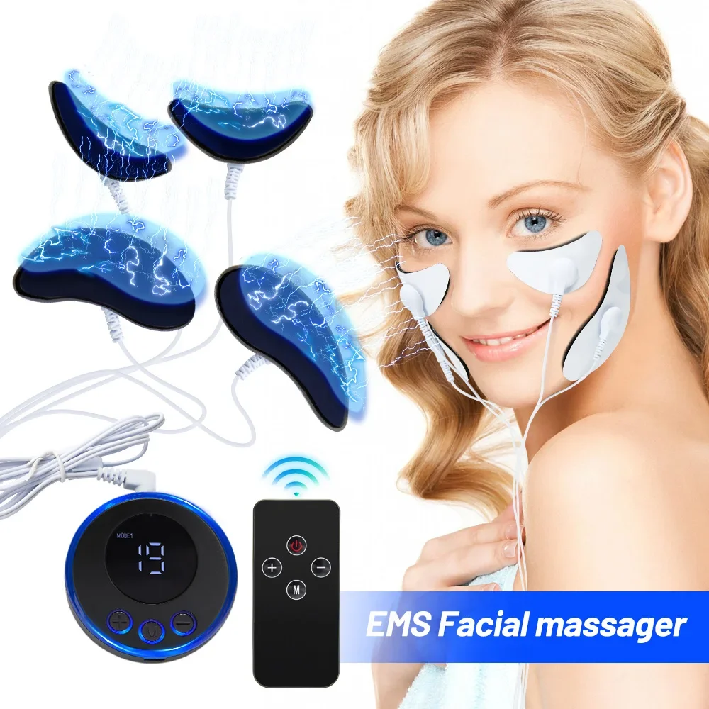 Smiling woman using EMS facial massager with eye and cheek pads, product components displayed on a cream linen surface