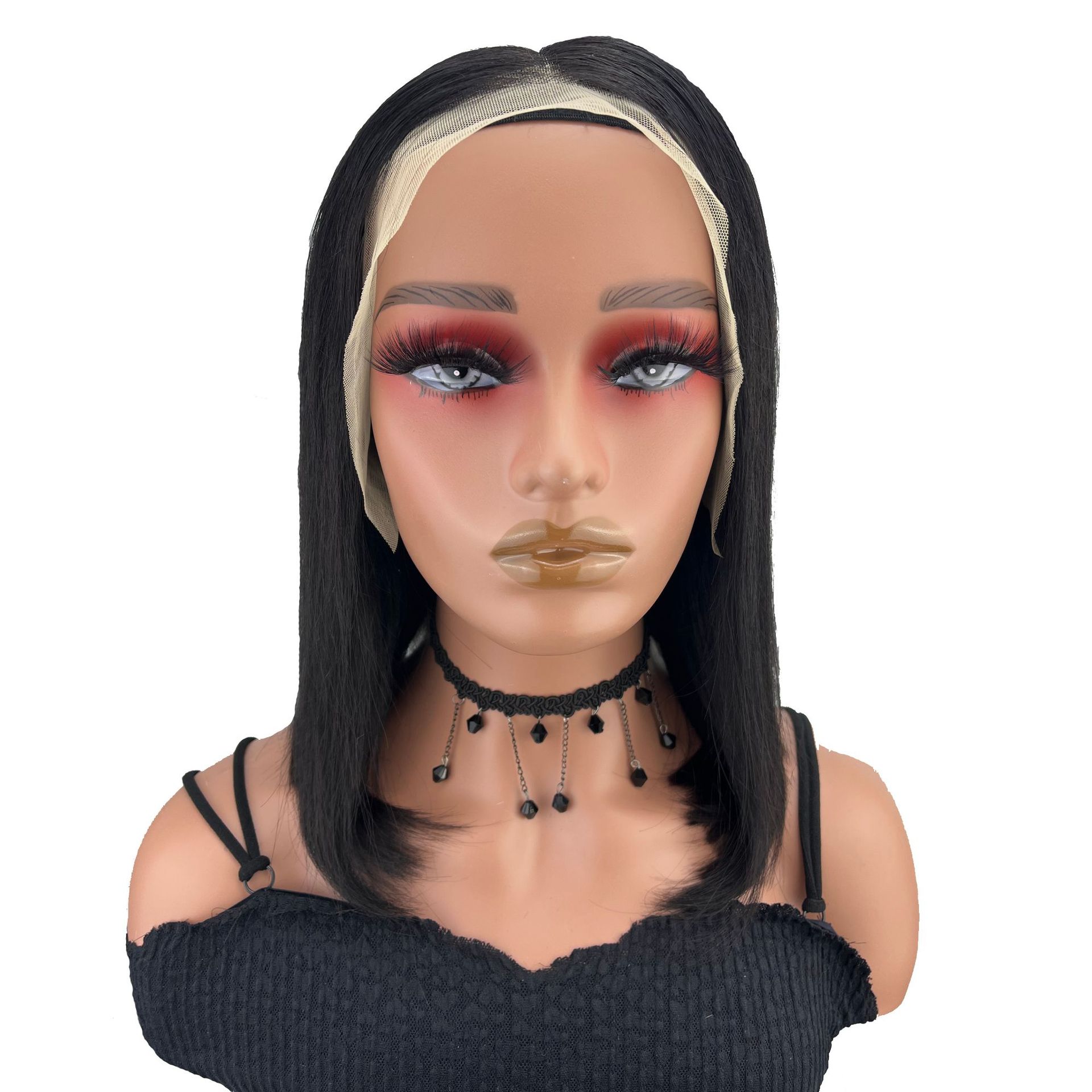 Front-facing woman wearing polished center-part bob