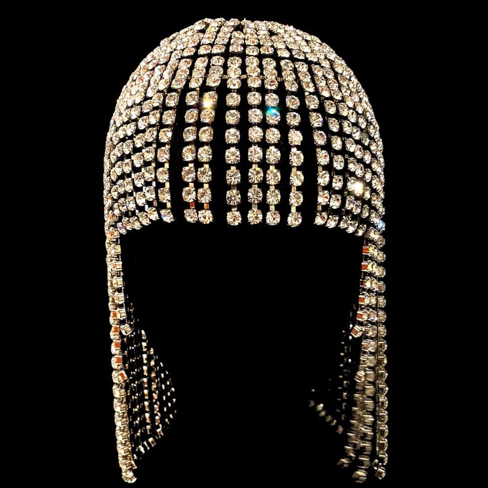Front view of dense crystal rows and long side tassels