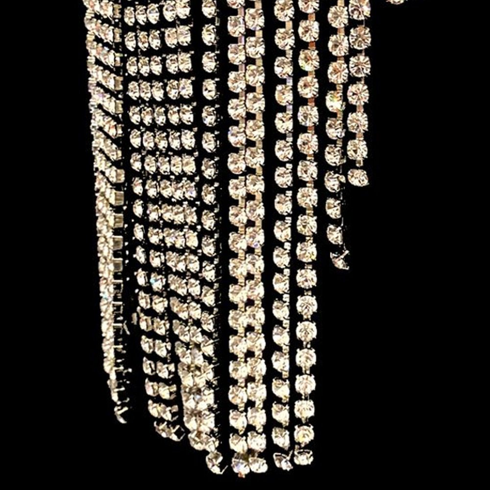 Close view of crystal tassels framing the face