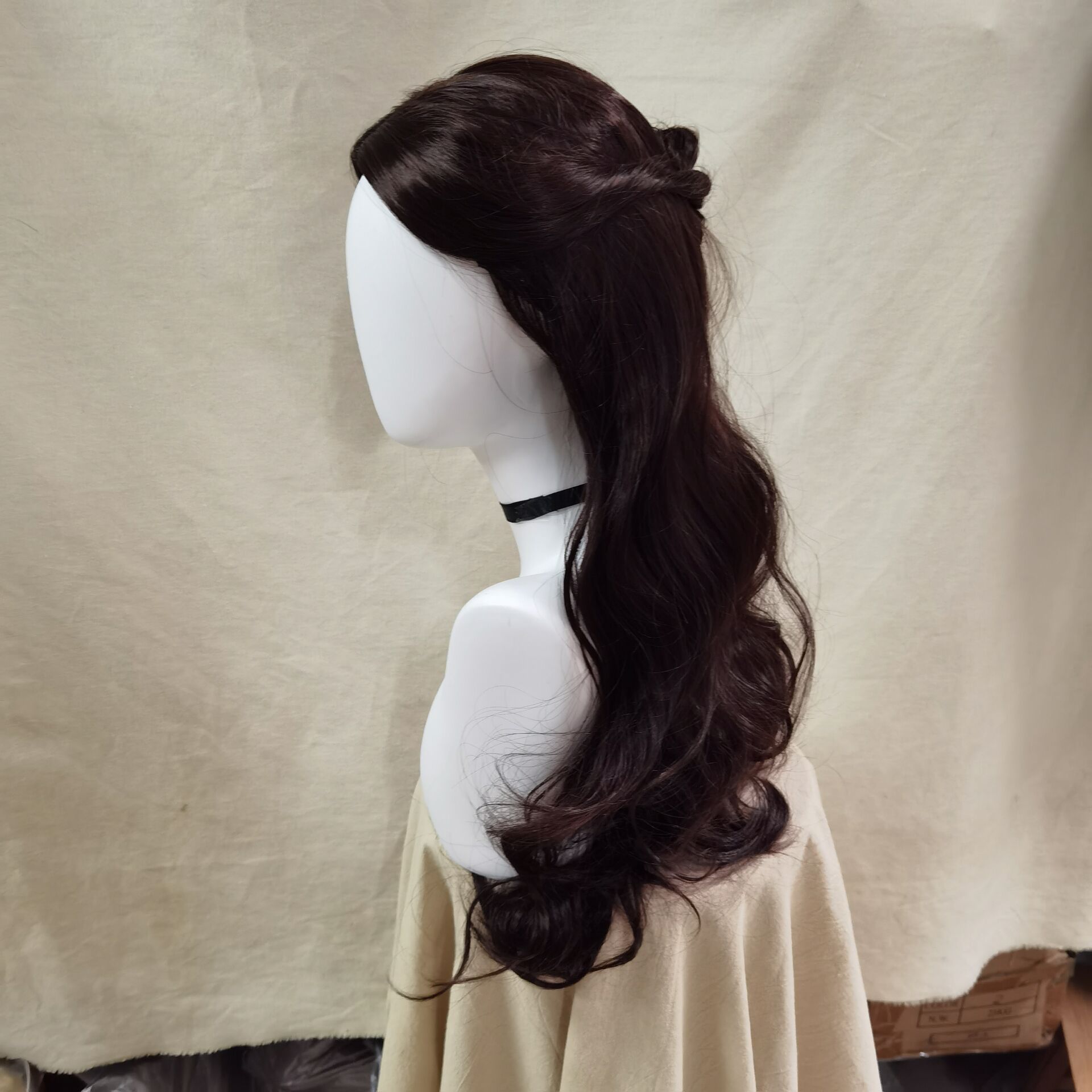 Close view of swept-back brown wig crown