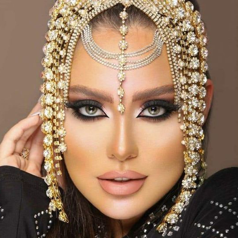 Side tassel strands framing a styled face