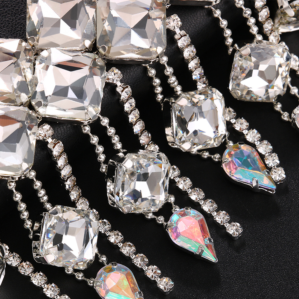 Faceted square rhinestones reflecting light in close detail