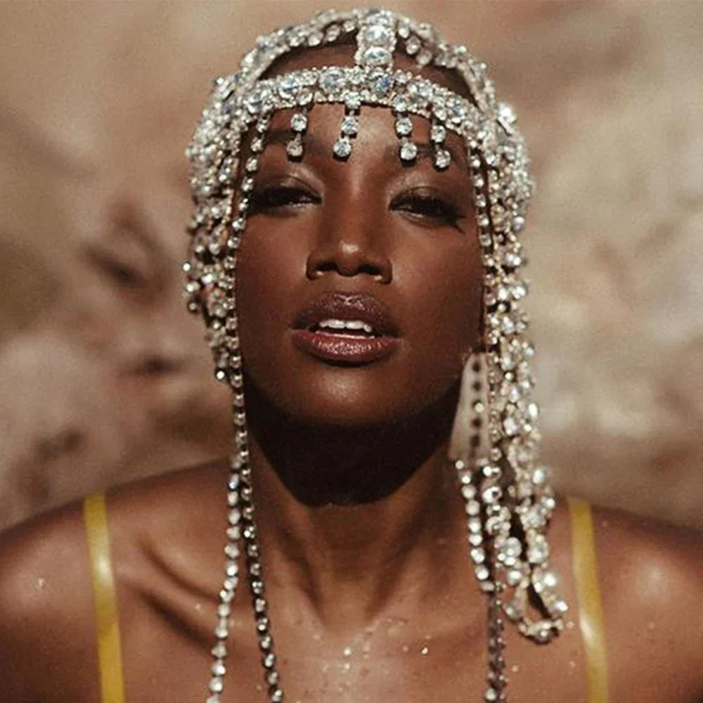 Crystal strands and forehead drops framing model face