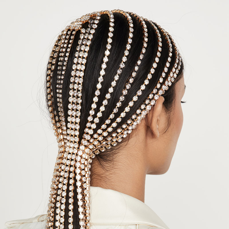Rhinestone rows following crown into long ponytail
