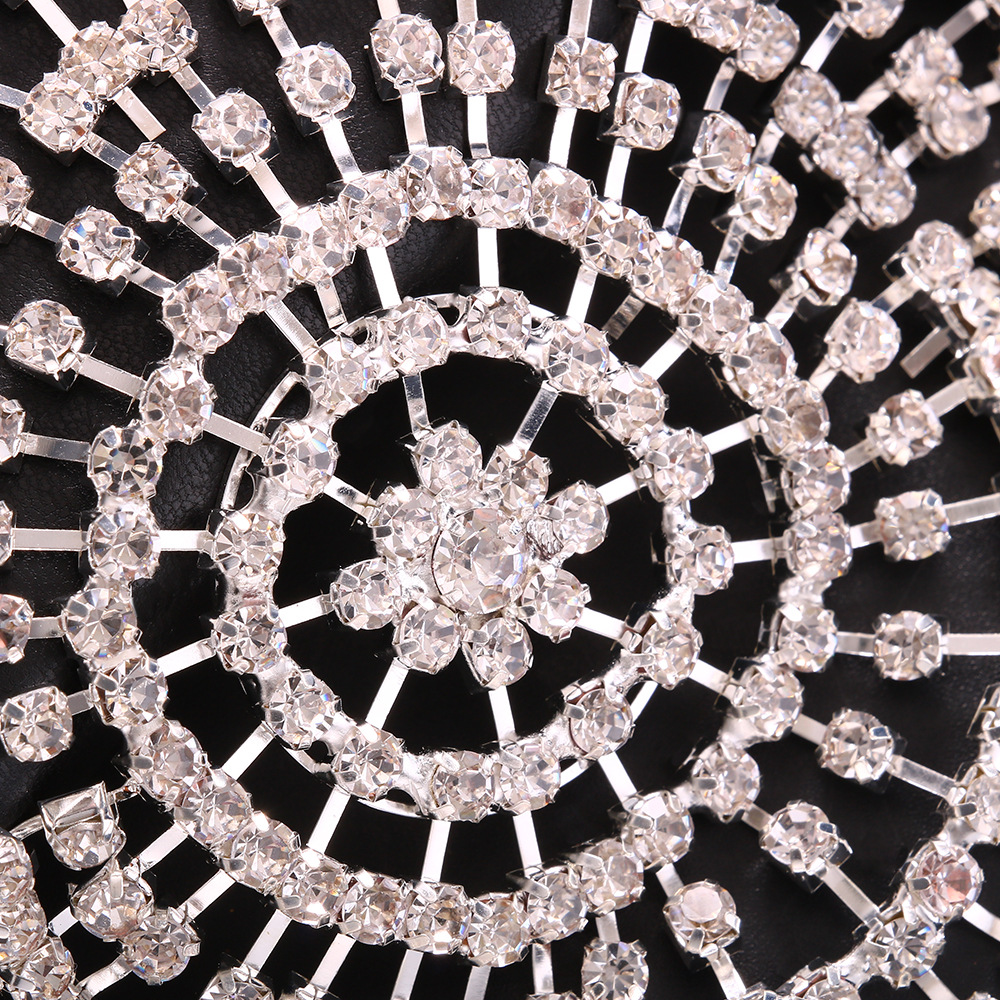 Close-up of faceted rhinestones and metal chain links