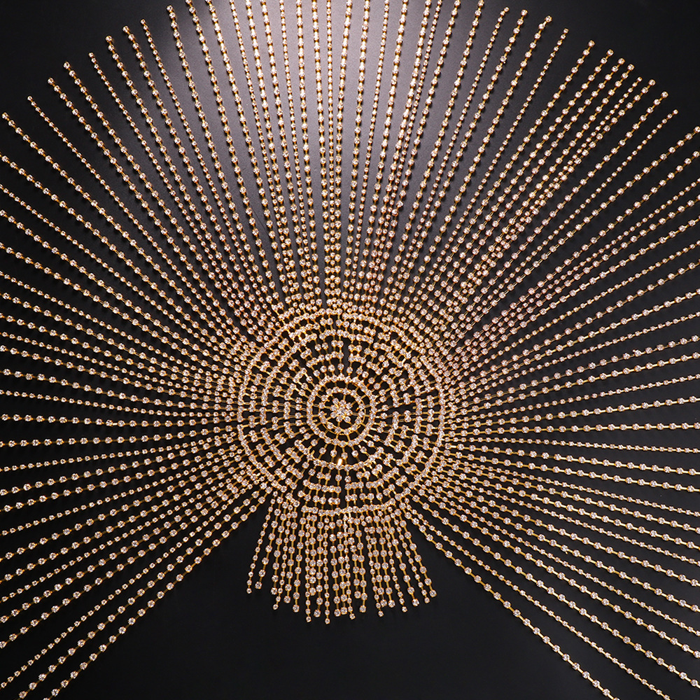 Gold hair chain with concentric rhinestone centerpiece