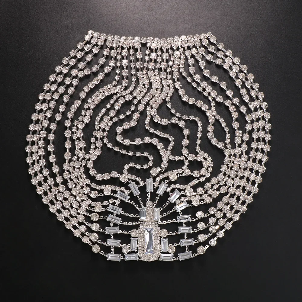 Close view of linked metal chains and faceted rhinestones