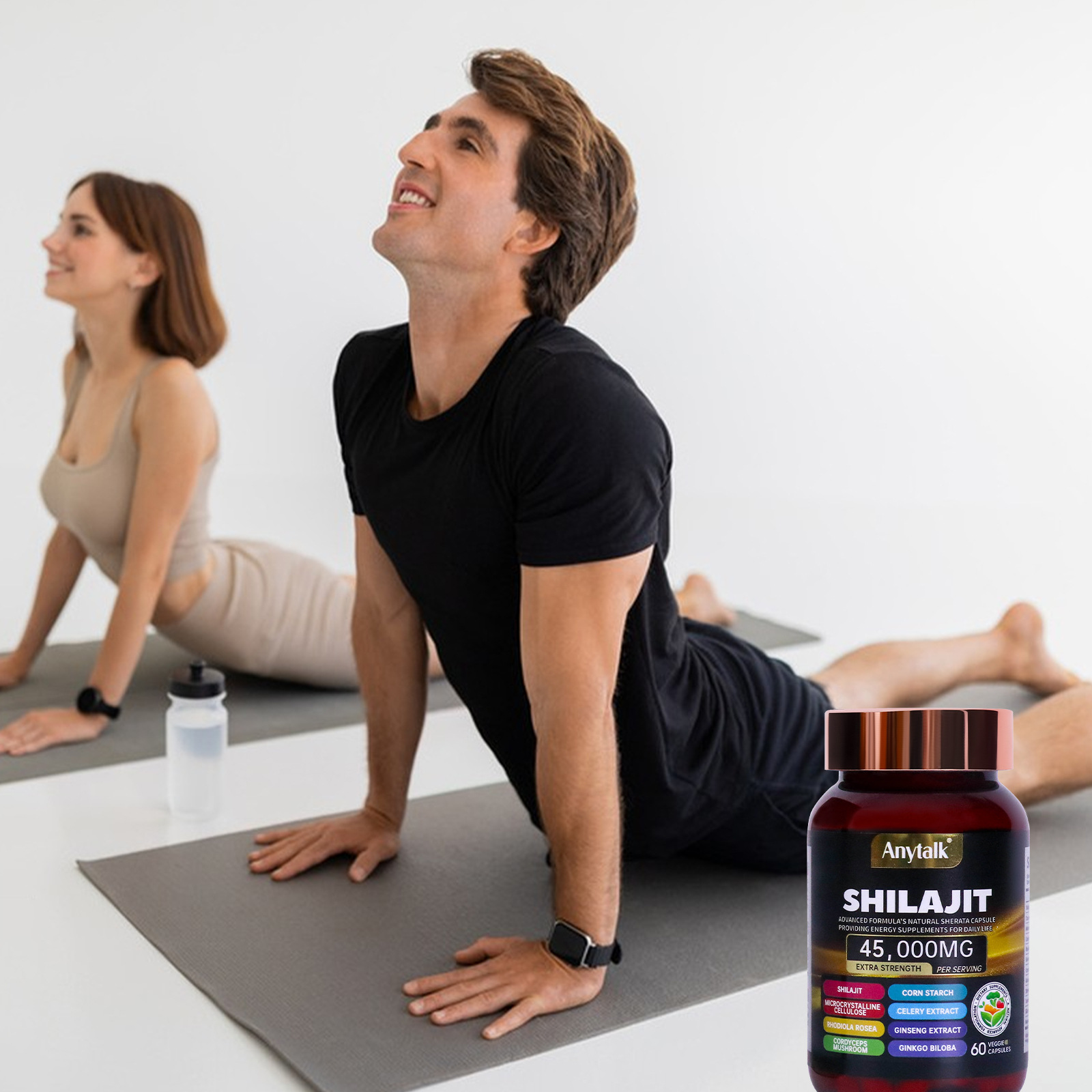 Young fit couple performing yoga with Shilajit bottle nearby, radiating energy and vitality