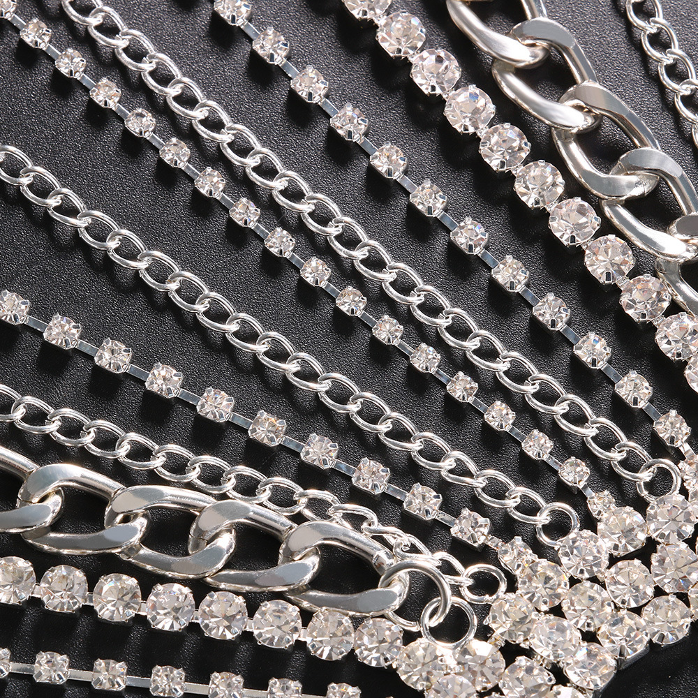 Close detail of rhinestones and polished chain links