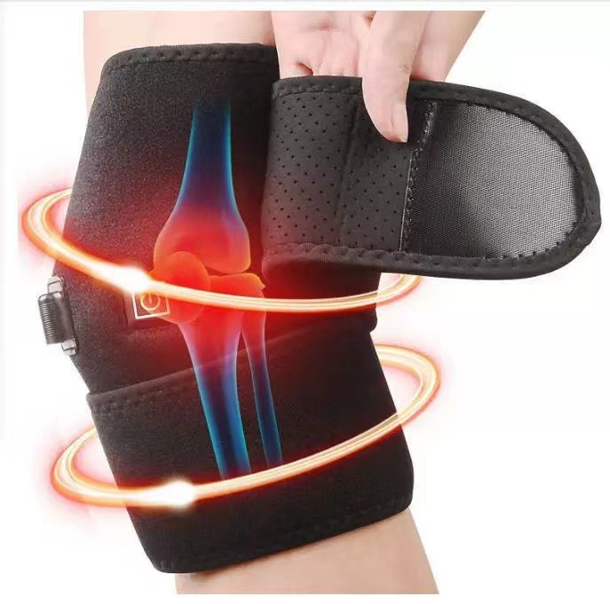 Heated knee wrap with glowing orange thermal lines radiating warmth around the joint, demonstrating active therapy