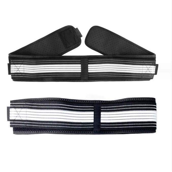 Two black and white mesh compression belts laid flat, symbolizing the need for targeted support