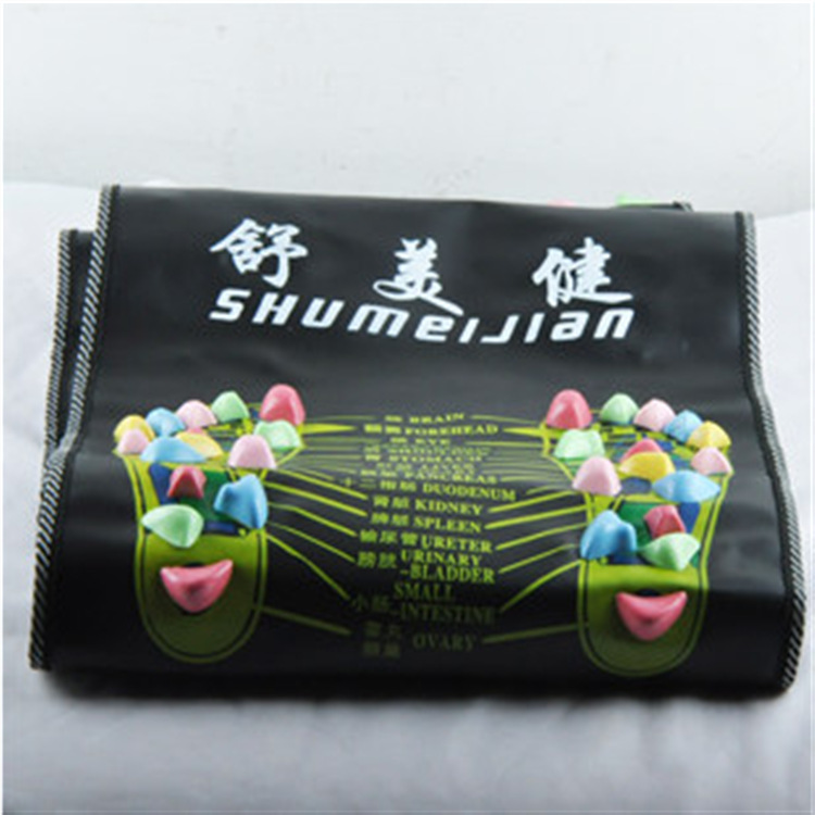 Retail packaging of foot massage carpet with Traditional Chinese Medicine foot zone diagram and colorful acupressure nodes visible