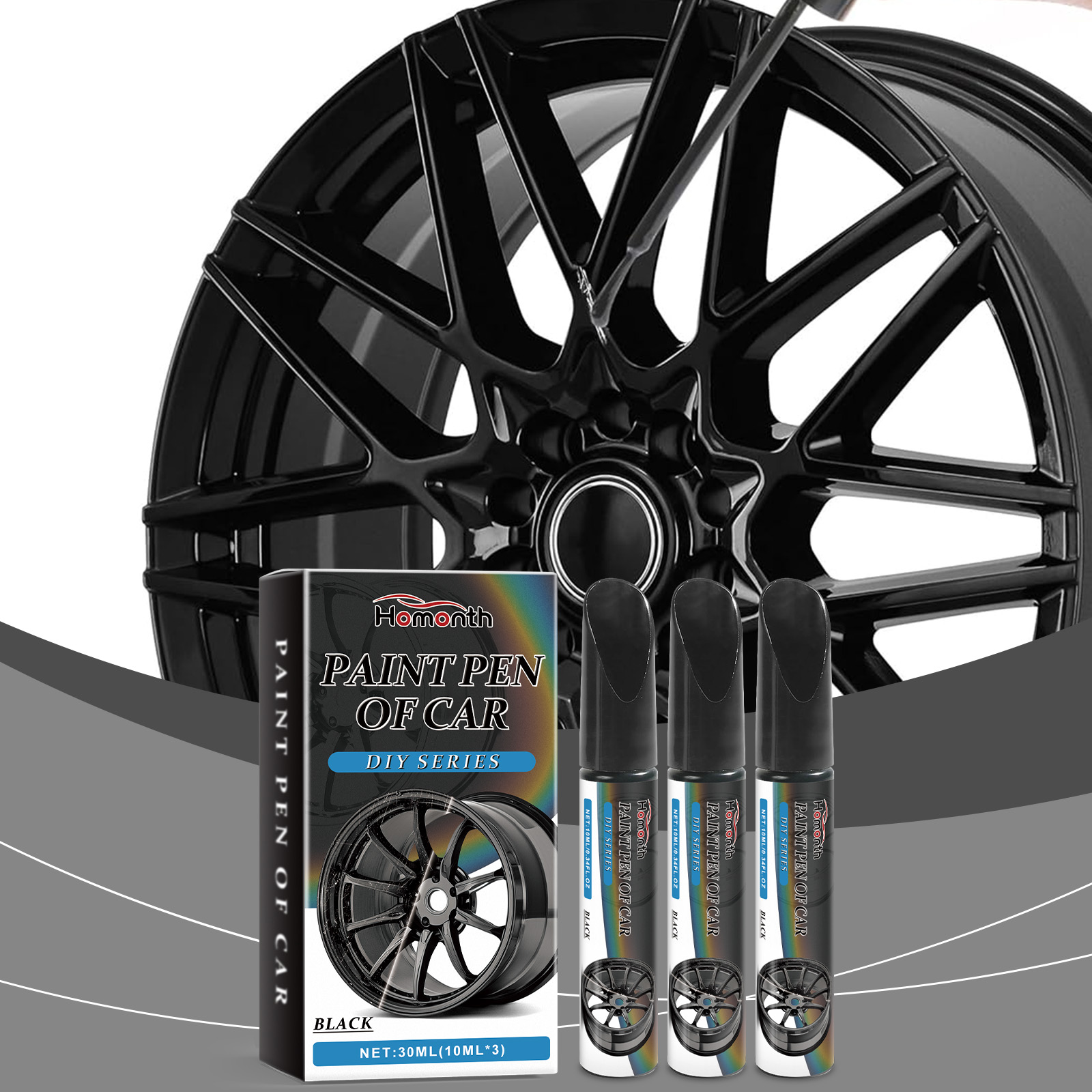 Three paint pens positioned near black alloy wheel