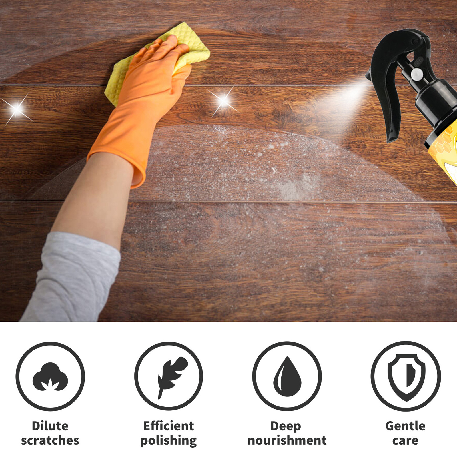 Hand applying spray and wiping a wooden floor