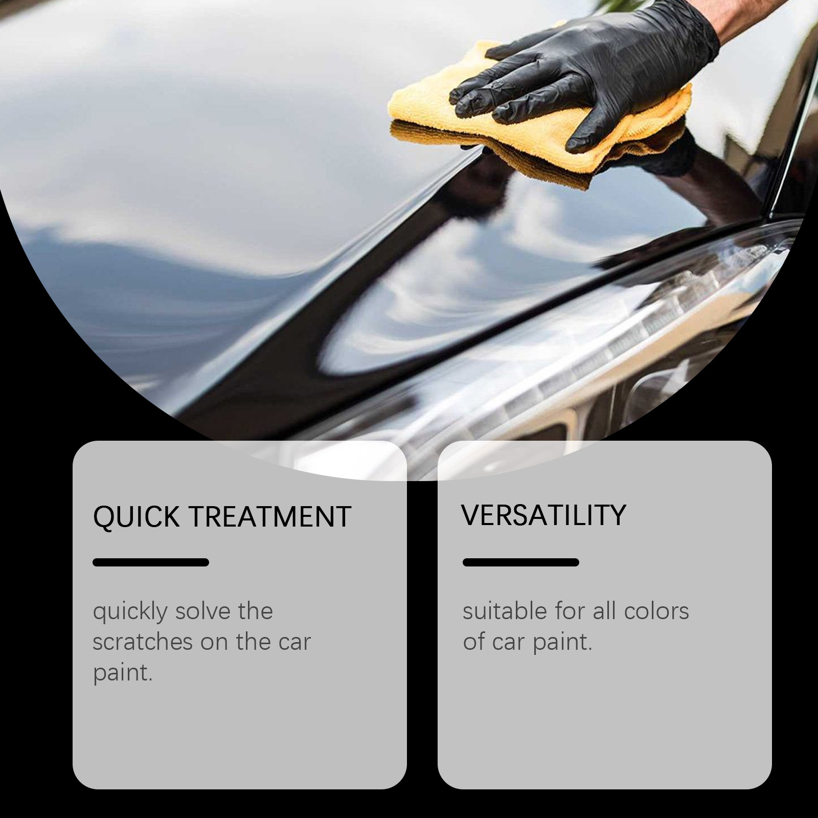 Hand polishing black car paint with yellow towel