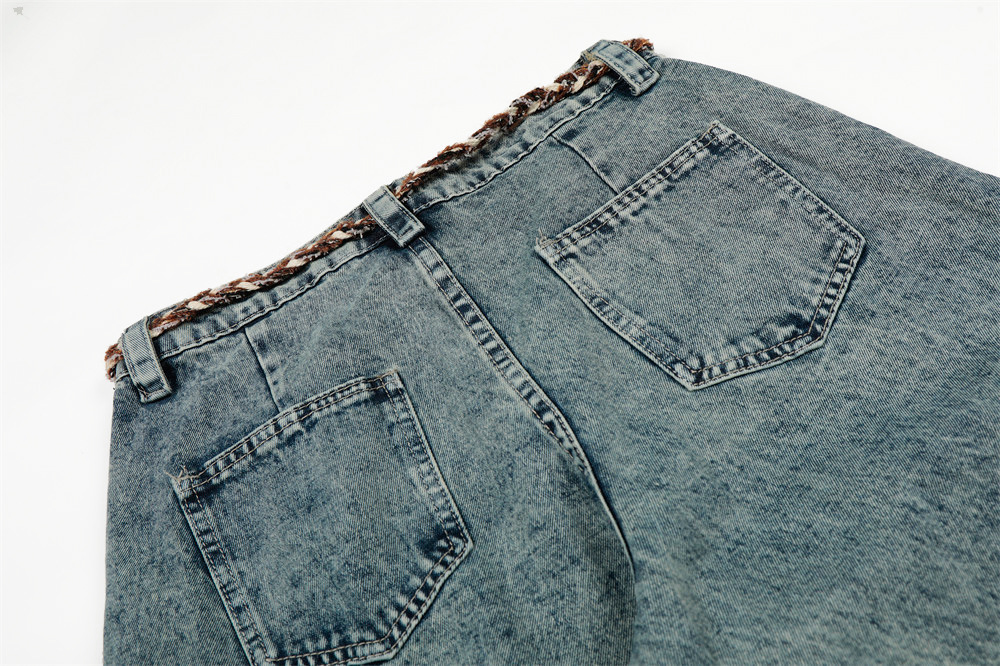 Loose fit jeans blue denim side profile mid-rise