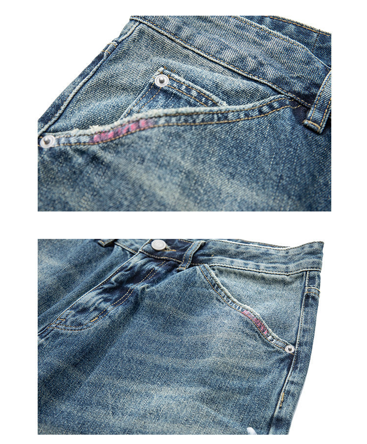 Distressed patch dyed jeans pocket detail close-up