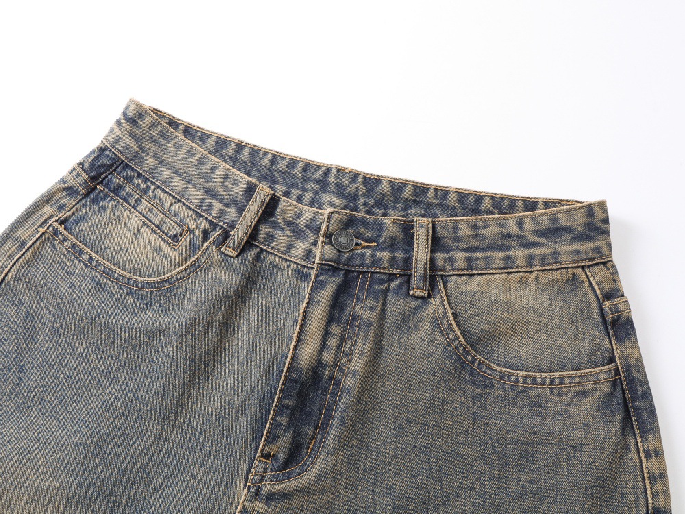 Loose blue jeans zipper fly mid-rise waist detail