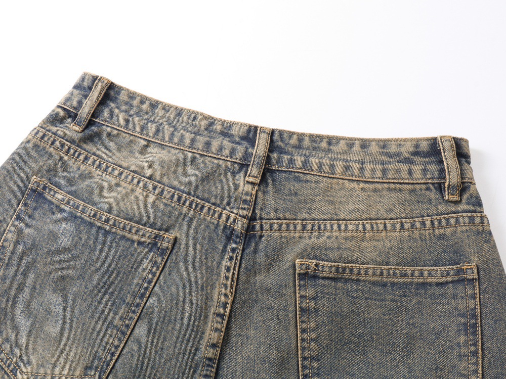 Washed denim jeans straight leg cuff opening detail