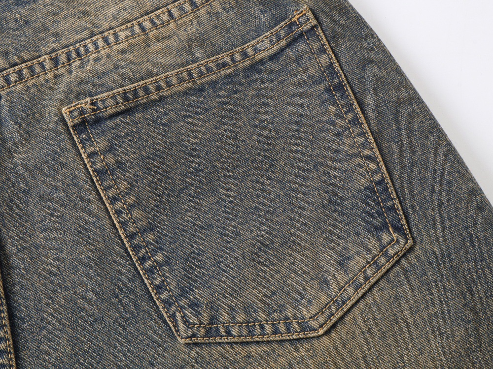 Loose blue jeans back pocket detail washed finish