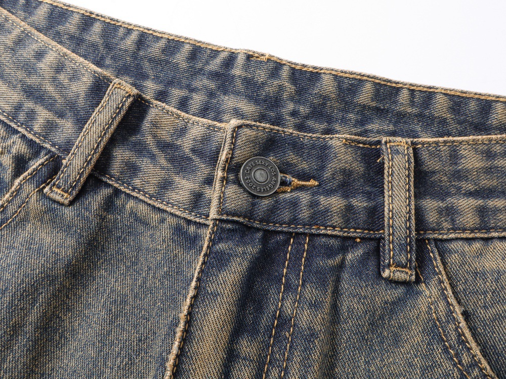 Distressed washed jeans straight cuff hem detail