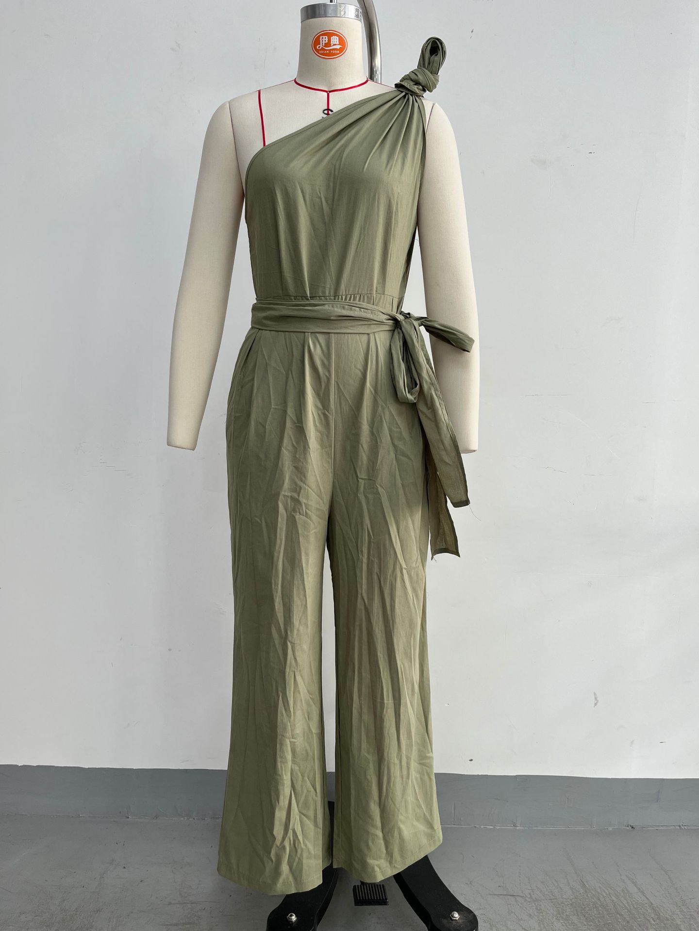 Women's sleeveless halter neck cinched waist slim jumpsuit in off white – high waist casual chic style