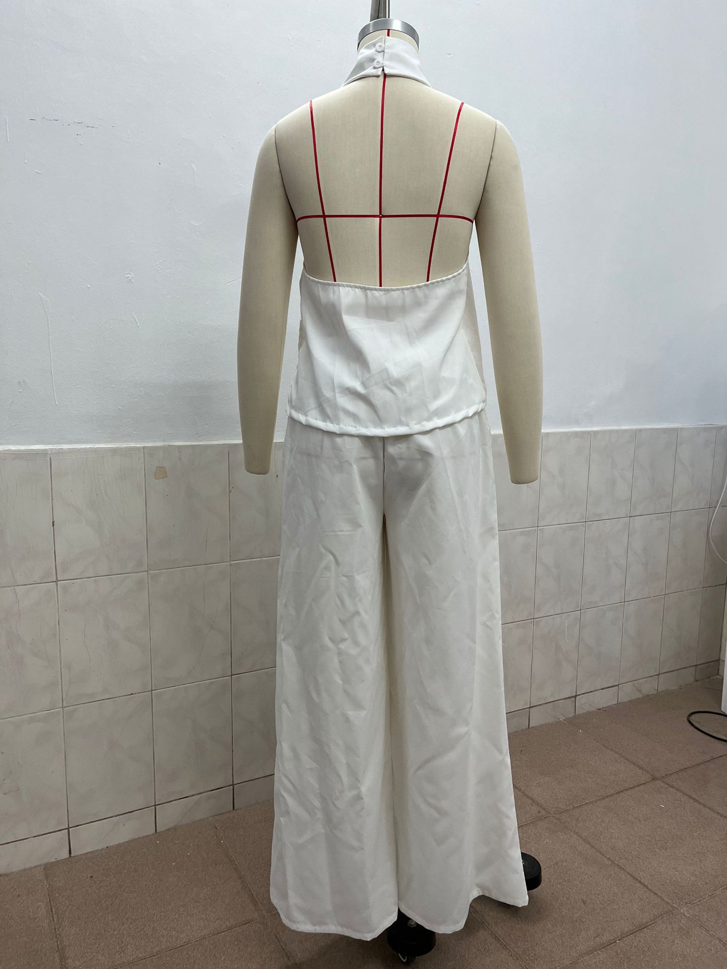 Women's loose sleeveless top and high-waist wide-leg pants set in khaki – minimalist casual style